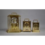A Modern Battery Operated Pillar Clock and Two Brass Cased Carriage Clocks with Quartz Movements