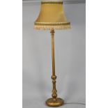 A Mid 20th Century Gilt Standard Lamp with Reeded Column Support, Complete with Shade