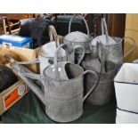 A Collection of Five Vintage Galvanized Iron Watering Cans