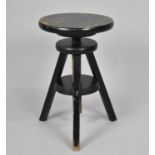 A Modern Circular Topped Swivel Adjustable Tripod Stool, 29cm Diameter