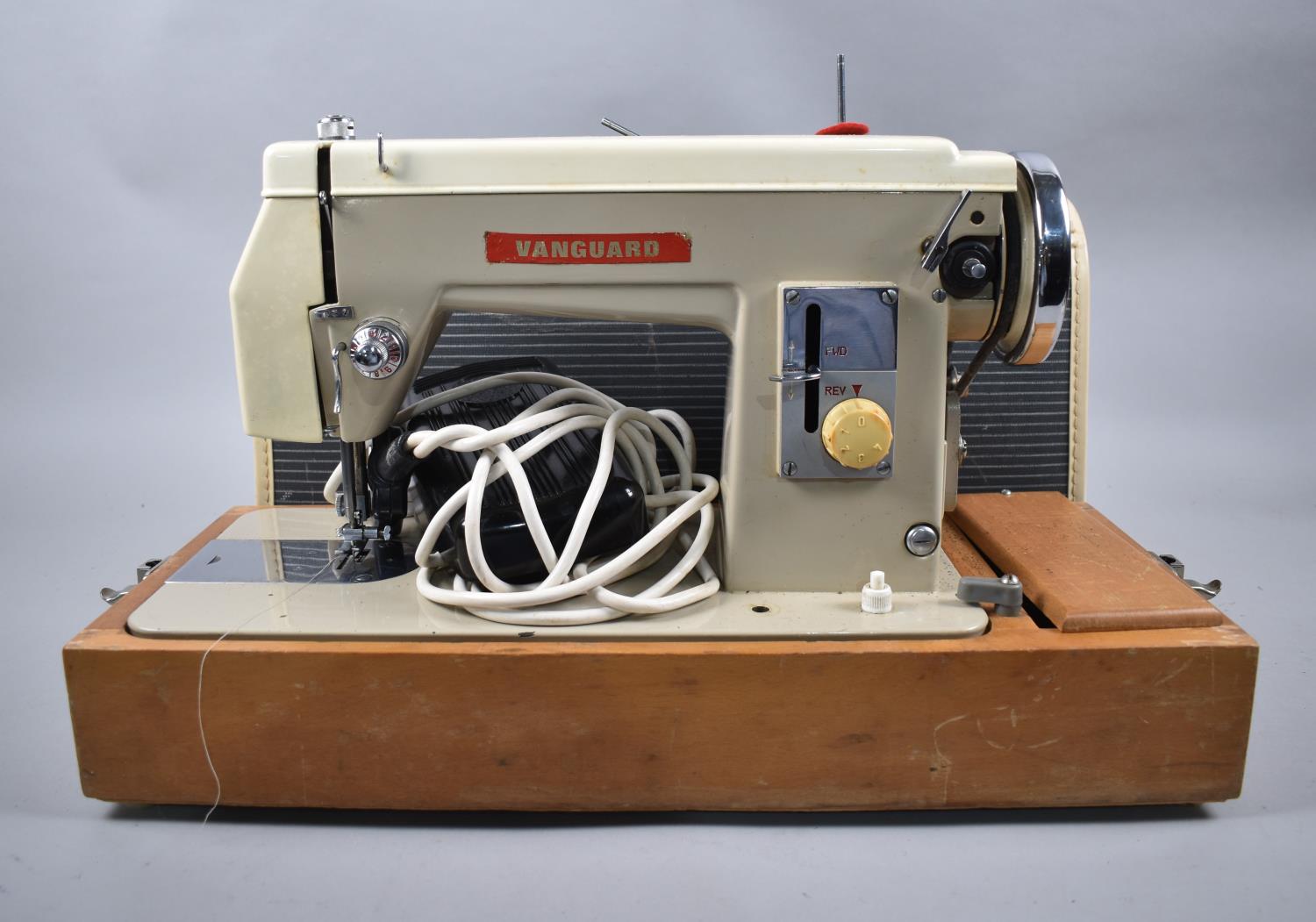 A Vintage Cased Vanguard Electric Sewing Machine, with Foot Pedal