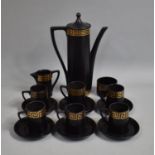 A Portmeirion Black Glazed Coffee Set With Gilt Greek Key Trim Designed by Susan Williams-Ellis to