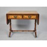 A Reproduction Burr Walnut Drop Leaf Miniature Sofa Table with Two Drawers, One Hinged Support