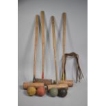 A Collection of Vintage Croquet Sundries to Include Mallets, Balls, Hoops