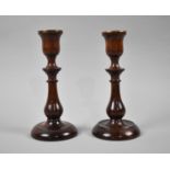 A Pair of Brass Mounted Turned Wooden Candle Sticks, 20cm high