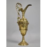 A Continental Gilt Brass Ornament in the Form of a Ewer with Swag Decoration to Vase Shape Body,