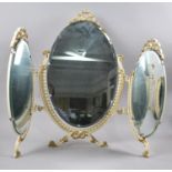 A MId 20th Century Cream and Gilt Three Fold Oval Dressing Table Mirror, 58cm wide