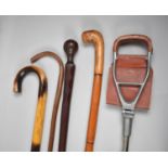 A Collection of Four Walking Sticks and a Shooting Stick