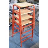 A Set of Four Stacking Metal Framed Stools