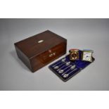 A 19th Century Rosewood Work Box Containing Two Later Travel Alarm Clocks and a Cased Set of Six