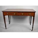 A Reproduction Mahogany Side Table with Two Drawers, Square Tapering Support Culminating in Casters,