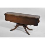 A Mid 20th Century Mahogany Drop Leaf Coffee Table on Four Scrolled Supports with Claw Feet, 91cm