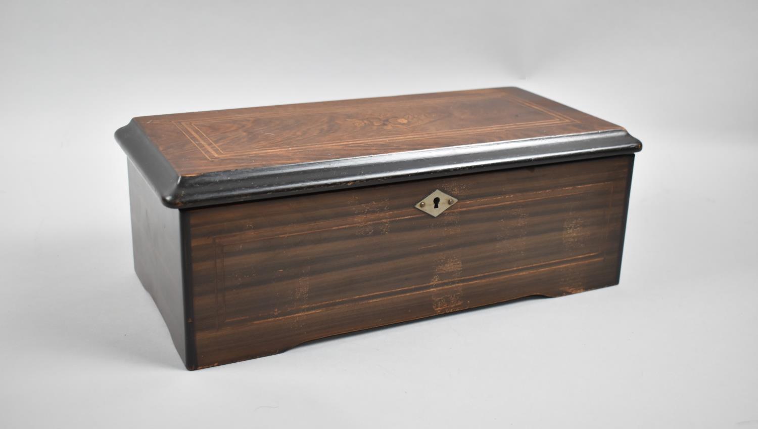 A Continental Rosewood and Marquetry Inlaid Cylinder Musical Box Playing Six Airs as Detailed on