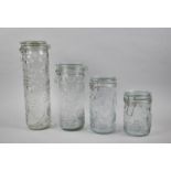 A Graduated Set of Four Moulded Glass Storage Jars, Tallest 32cm
