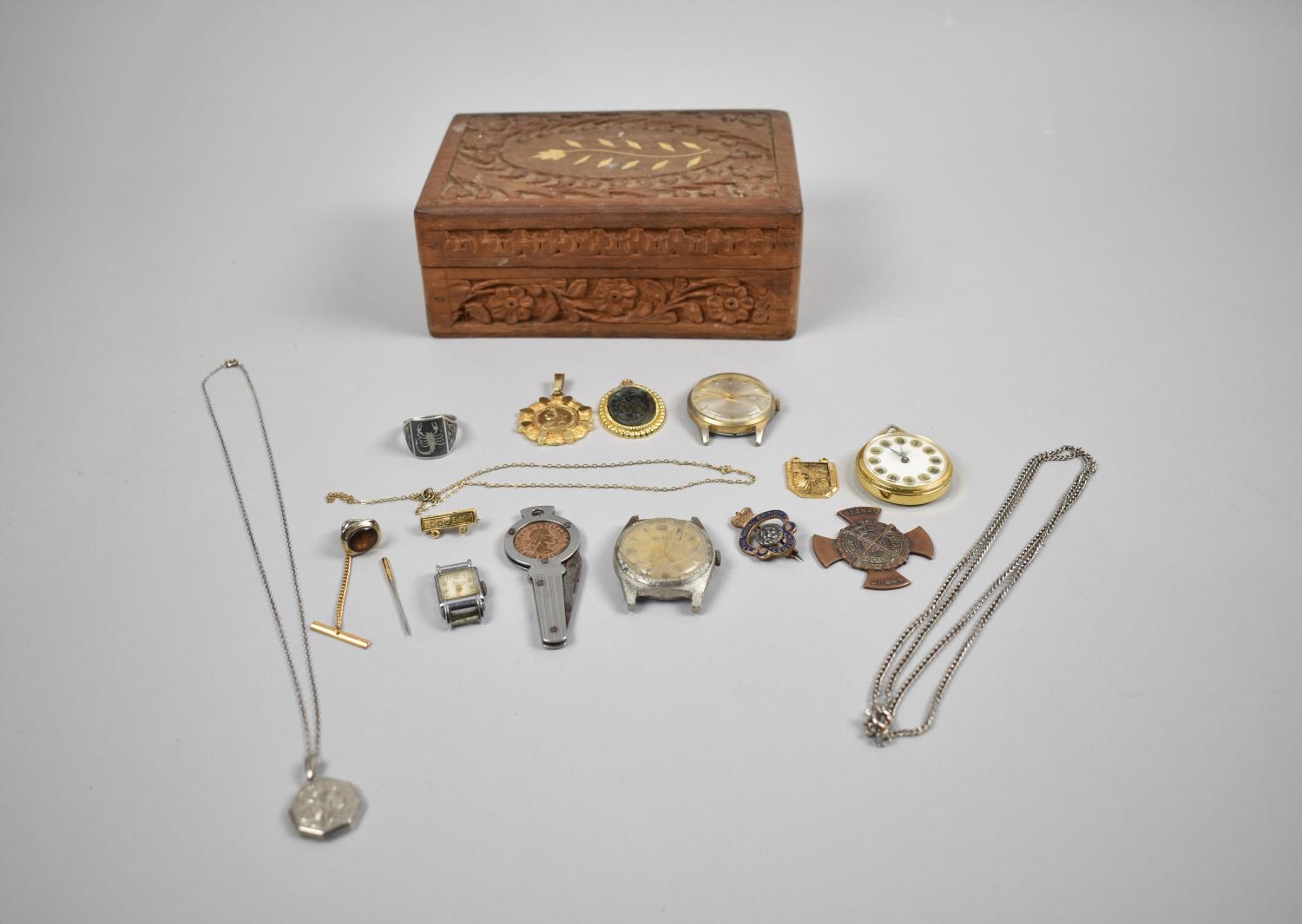 A Carved Indian Wooden Box Containing Various Medals, Wrist Watch Movement etc