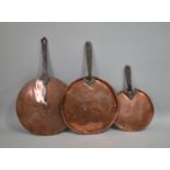 A Collection of Three Late Victorian Copper Saucepan Lids with Iron Handles