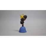 A Novelty Handbell in the Form of an African Lady, 13cm high