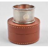 A Leather Gents Stud Case Containing Unrelated Silver Napkin Ring with Engine Turned Decoration,