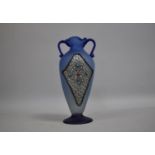 A Hand Blown Two Handled Blue Glass Vase with Applied Jewelled White Metal Panels and Cabochons,