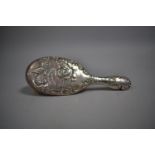 A Silver Mounted Dressing Table Hair Brush Decorated with Cherubs