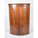 A Late 19th Century Flame Mahogany Wall Hanging Corner Cupboard with Bow Front, 72cm wide