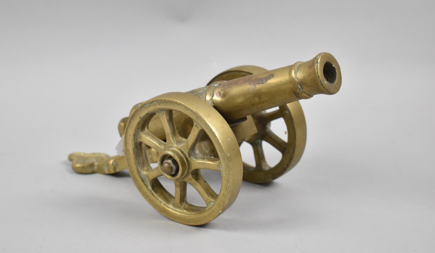 A Heavy Brass Model of an 1812 Cannon, 28cm Long