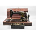 A Vintage Cased Vesta Manual Sewing Machine, with Original Tin Containing Accessories