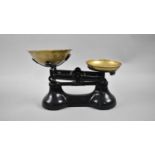 A Set of Black Painted Kitchen Scales with Brass Pans