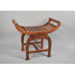 A Far Eastern X Framed Stool with Carved Decoration, 71cm wide