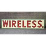 A Large Framed Painted Canvas Shop Sign, "Wireless", 305x66cm