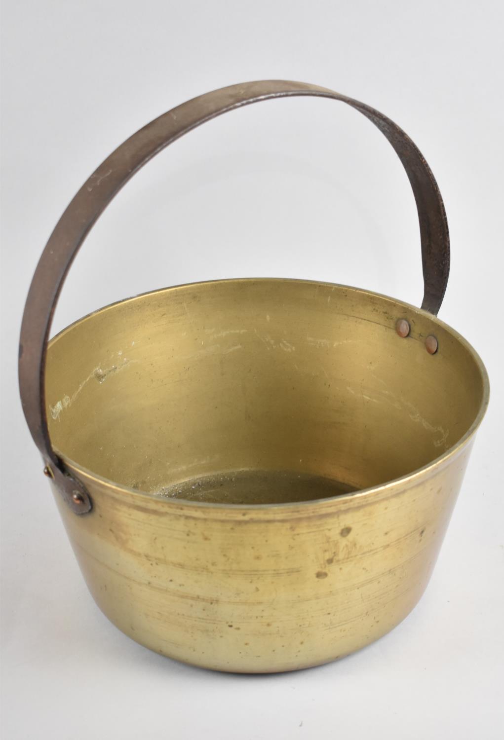 A Large Vintage Brass Jam Kettle with Iron Loop Handle, 30cm Diameter
