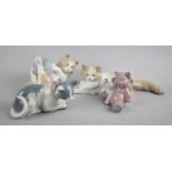 A Collection of Four Nao Cat Ornaments