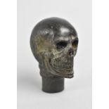 A Novelty Bronze Walking Stick Handle in the Form of a Skull, 7cms High