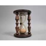 A Mid 20th Century Mahogany Cased Hour Glass, 14cm Diameter and 19cm High