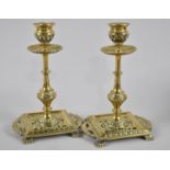 A Pair of Late 19th Century Brass Candlesticks on Pierced Rectangular Bases with Twin Carry Handles,