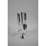 A Modern Silver Plated Four Piece Bar Tool Set comprising Ice Scoop, Bottle Opener, Corkscrew and