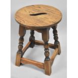 A Mid 20th Century Oak Circular Topped Stool with Cut-out S Carrying Recess, 37cm Diameter