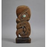 A Carved Wooden Maori Tiki Figure, 24cm high