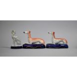 Two 19th Century Glazed Staffordshire Pen Stands in the Form of Reclining Greyhounds Together with a
