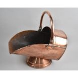 A Late 19th Century Copper Helmet Shaped Coal Scuttle, 42cm Long