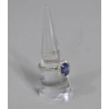 A Pretty Ladies Silver Dress Ring having Blue Glass Stone with Halo of White CZs
