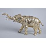 A Heavy Silver Plated White Metal Study of Elephant with Trunk in Salute, 14cms Long