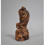 An Oriental Carved Wooden Figure, Robed Elder, Standing on Rock, 17.5cms High