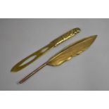 A Brass Novelty Pen Quill in the Form of a Feather together with a Pierced Brass Letter Opener