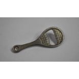 A Novelty Bottle Opener in the Form of a Tennis Racket, 9cms Long
