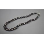 A String of Honura Silver Coloured Pearls with Silver Clasp, Complete with Pouch and Original Box