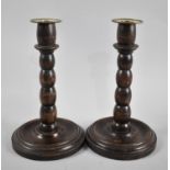 A Pair of Edwardian Brass Topped Turned Oak Candlesticks with Bobbin Supports, 23cms High