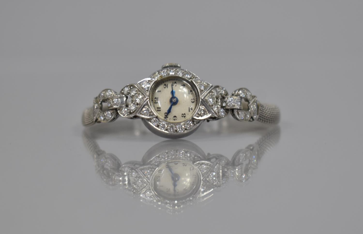 An Early to Mid 20th Century 9ct White Gold and Diamond Cocktail Watch. Silvered Dial with Arabic