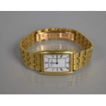 A Baume and Mercier 17605 18ct Gold Wristwatch on a 18ct Gold Strap, Tank Style with White Enamel