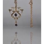 A 9ct Gold Edwardian Purple Stone and Pearl Pendant on a 9ct Gold Belcher Chain. Openwork Foliate